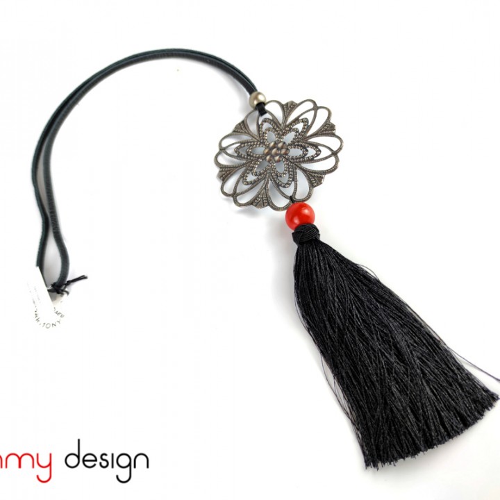 Necklace designed with the flower pendant and black tassel